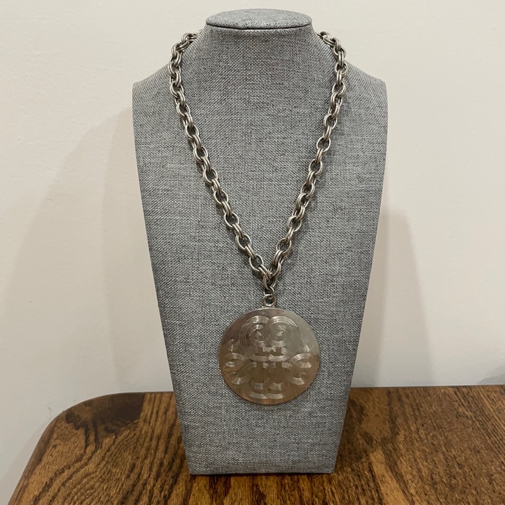 Vintage silver necklace with round embossed pendant